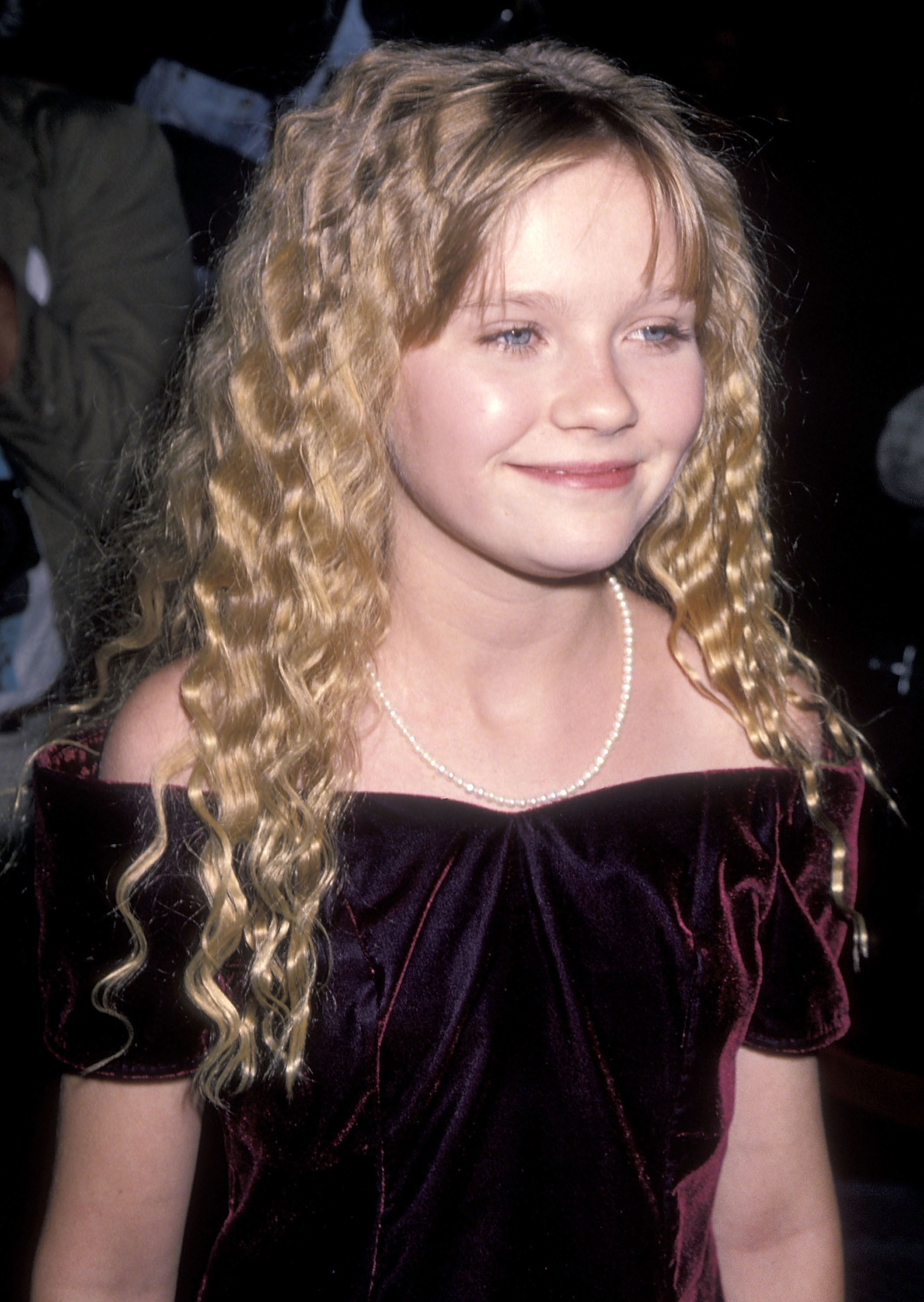 Close-up of Kirsten smiling as a child