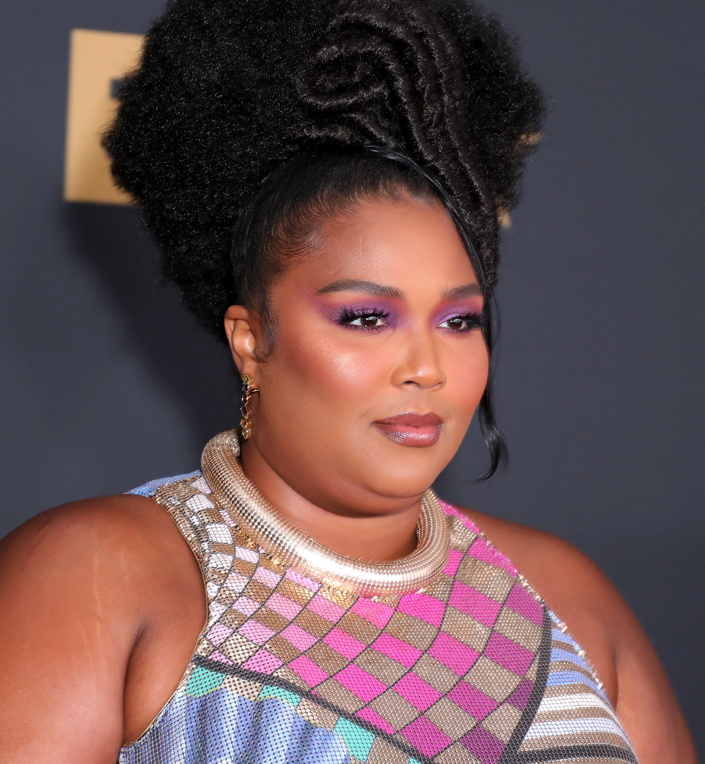 Close-up of Lizzo at a media event