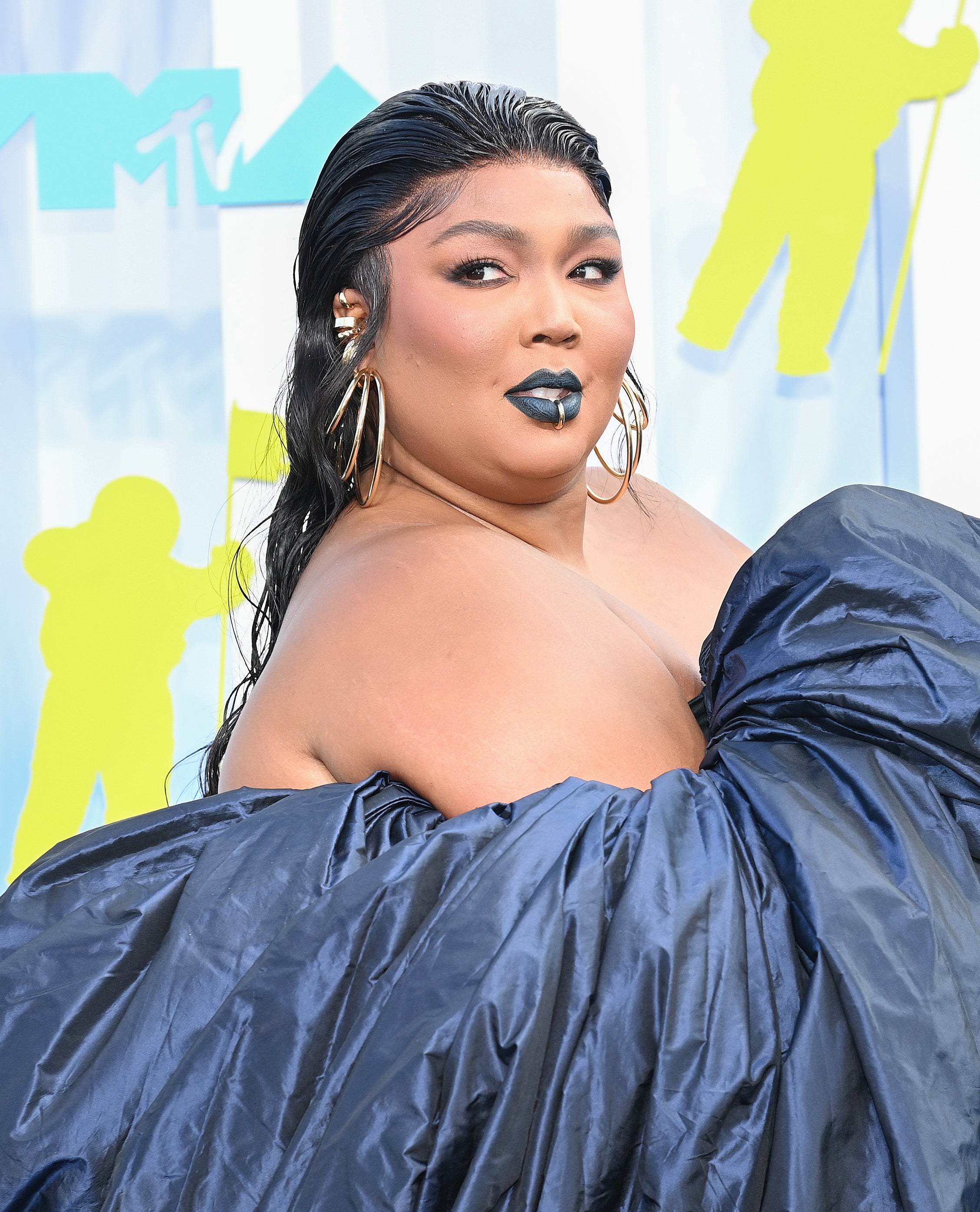 Close-up of Lizzo at a media event