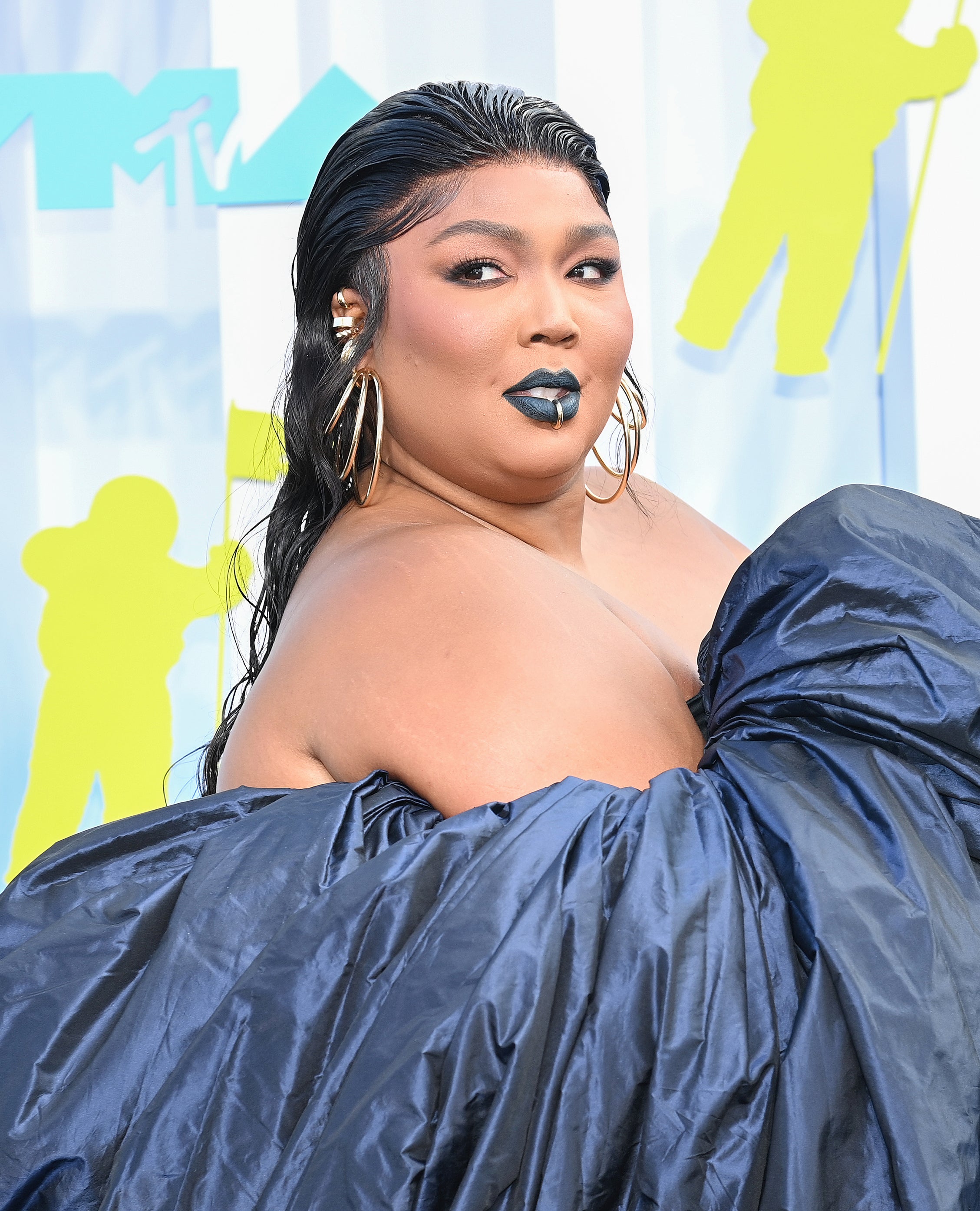 Close-up of Lizzo at a media event