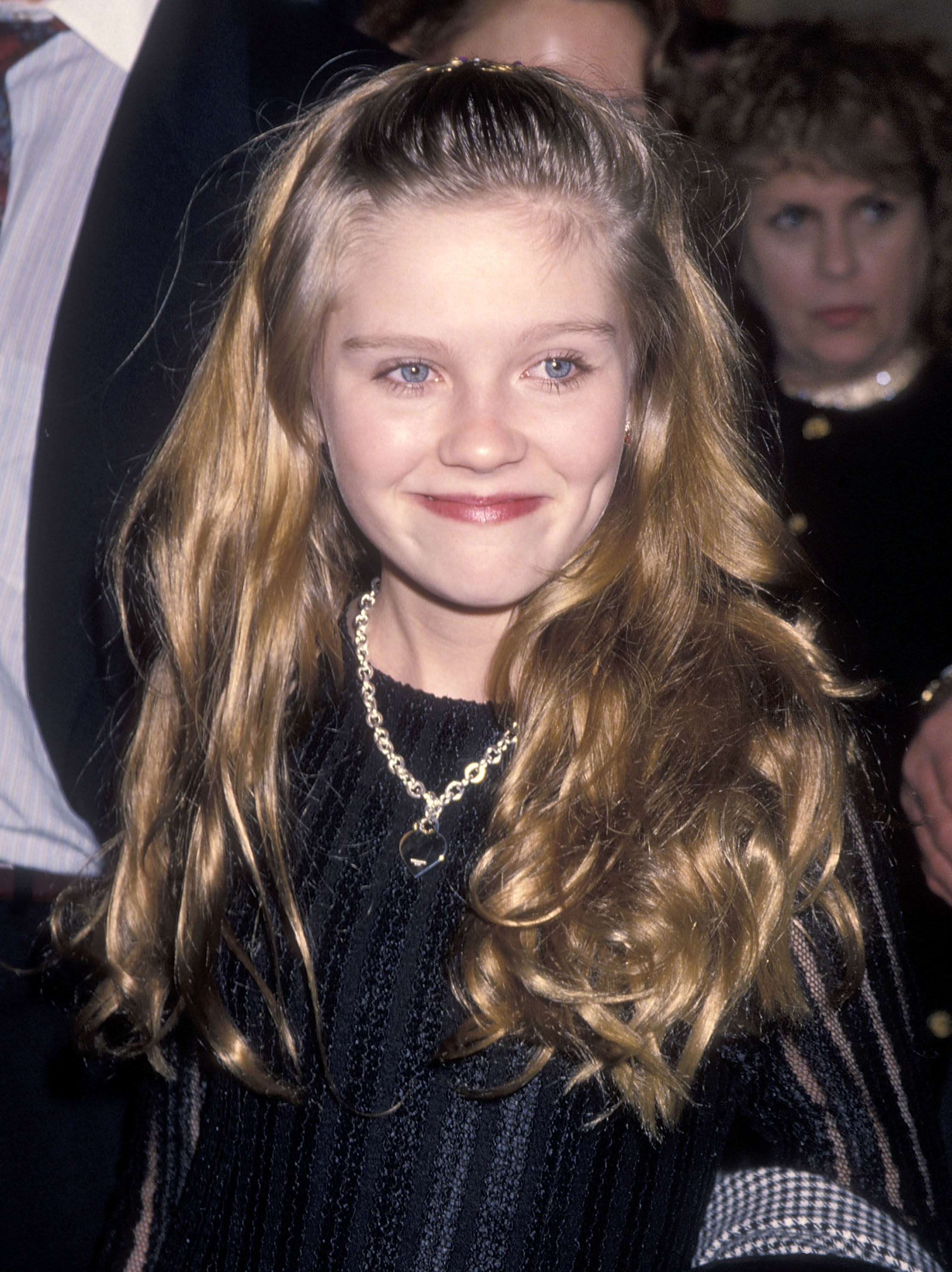 Close-up of Kirsten smiling as a child