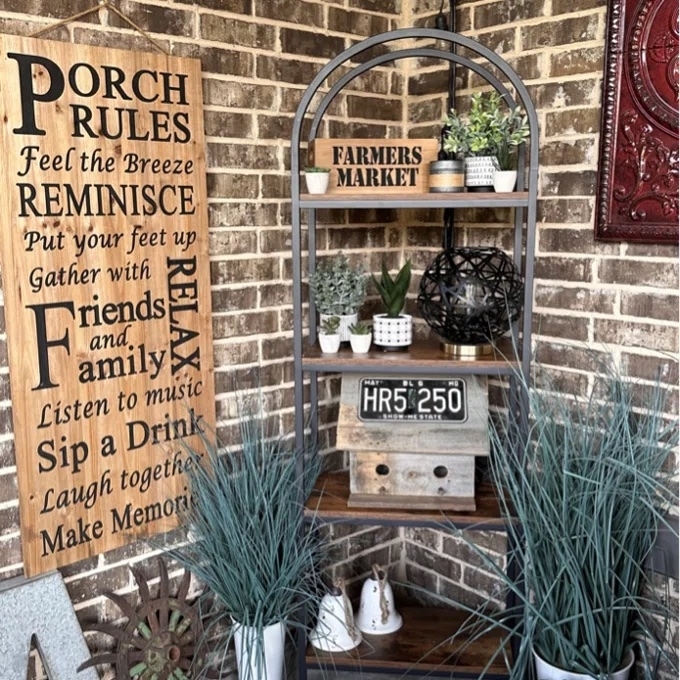 A brown and black bookshelf with rustic items on it