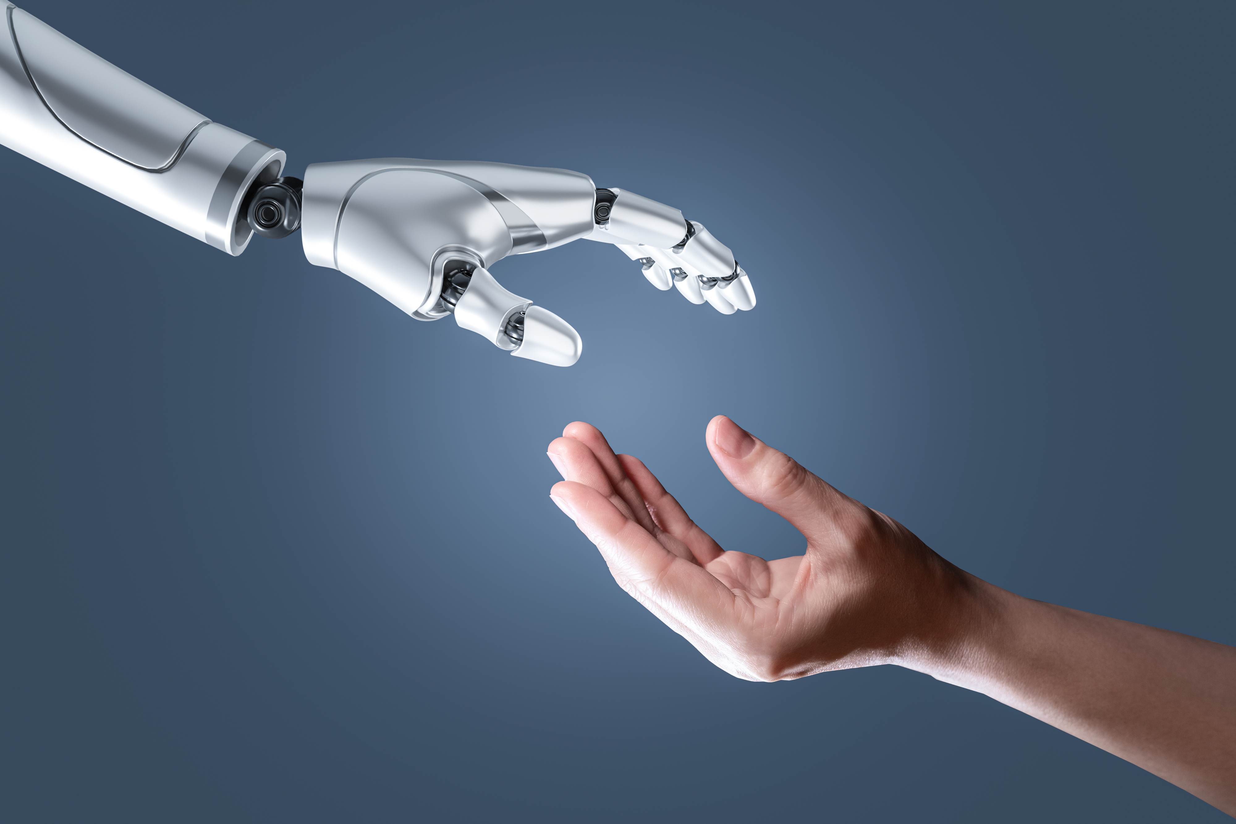 human hand reaching out to a robot hand