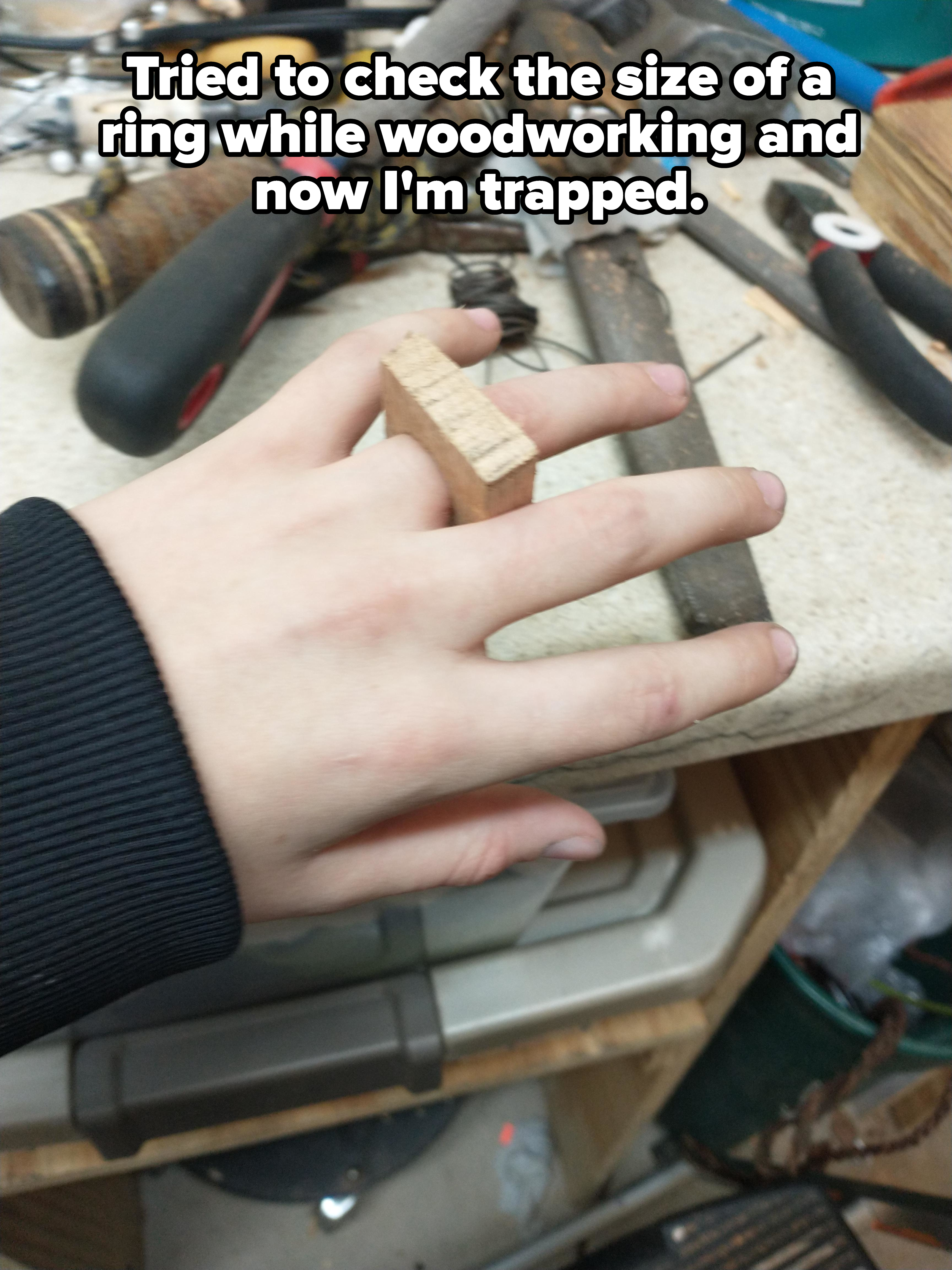 A block of wood on someone&#x27;s finger