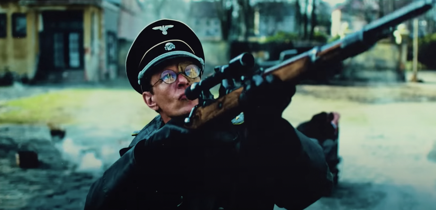 a nazi holds a rifle