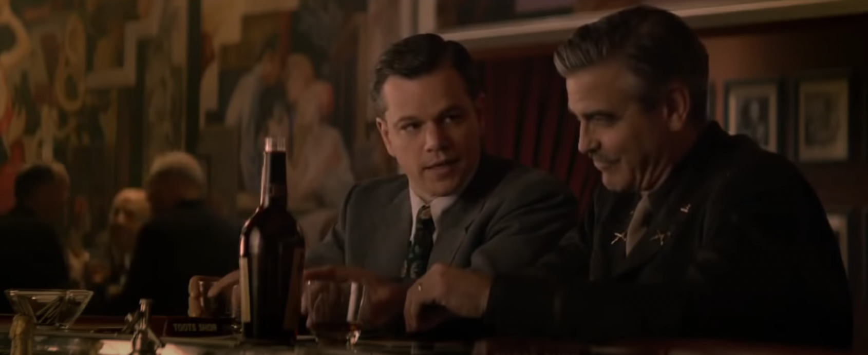 Matt Damon and George Clooney at a bat