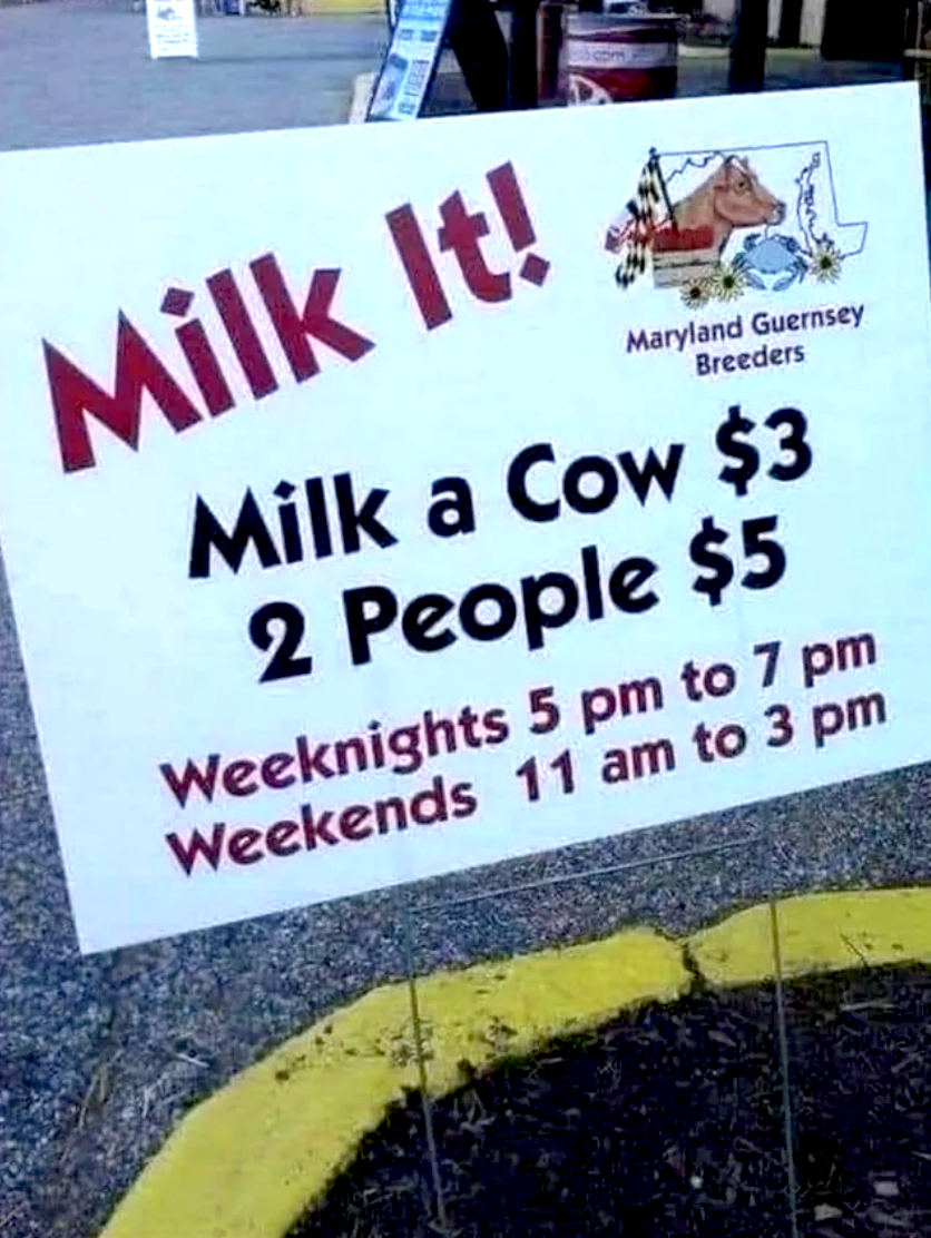 A sign that says &quot;Milk it! Milk a cow $3, 2 people $5&quot;