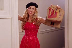Carrie Bradshaw from Sex and the City holding a McDonald's bag