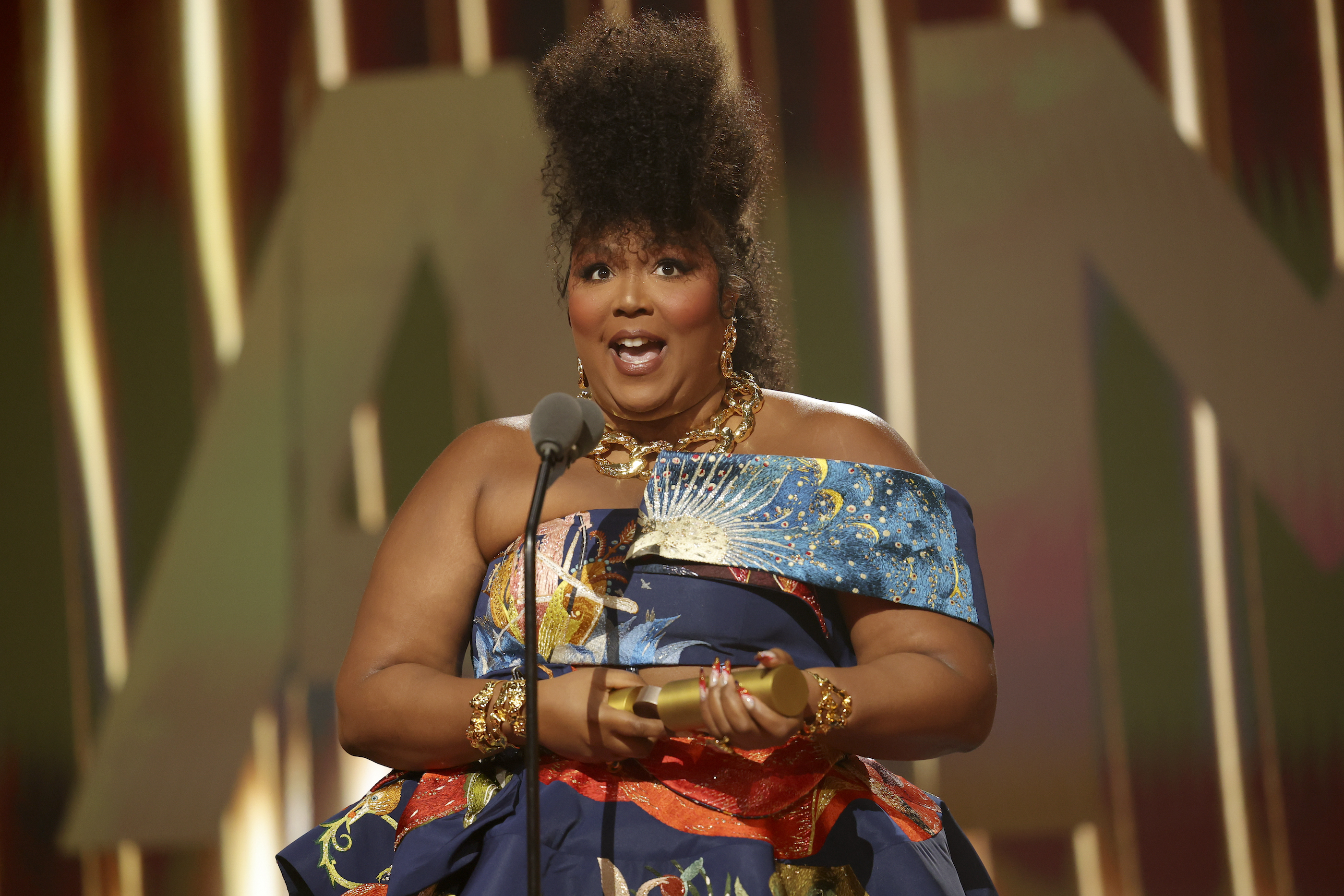 lizzo accepting an award