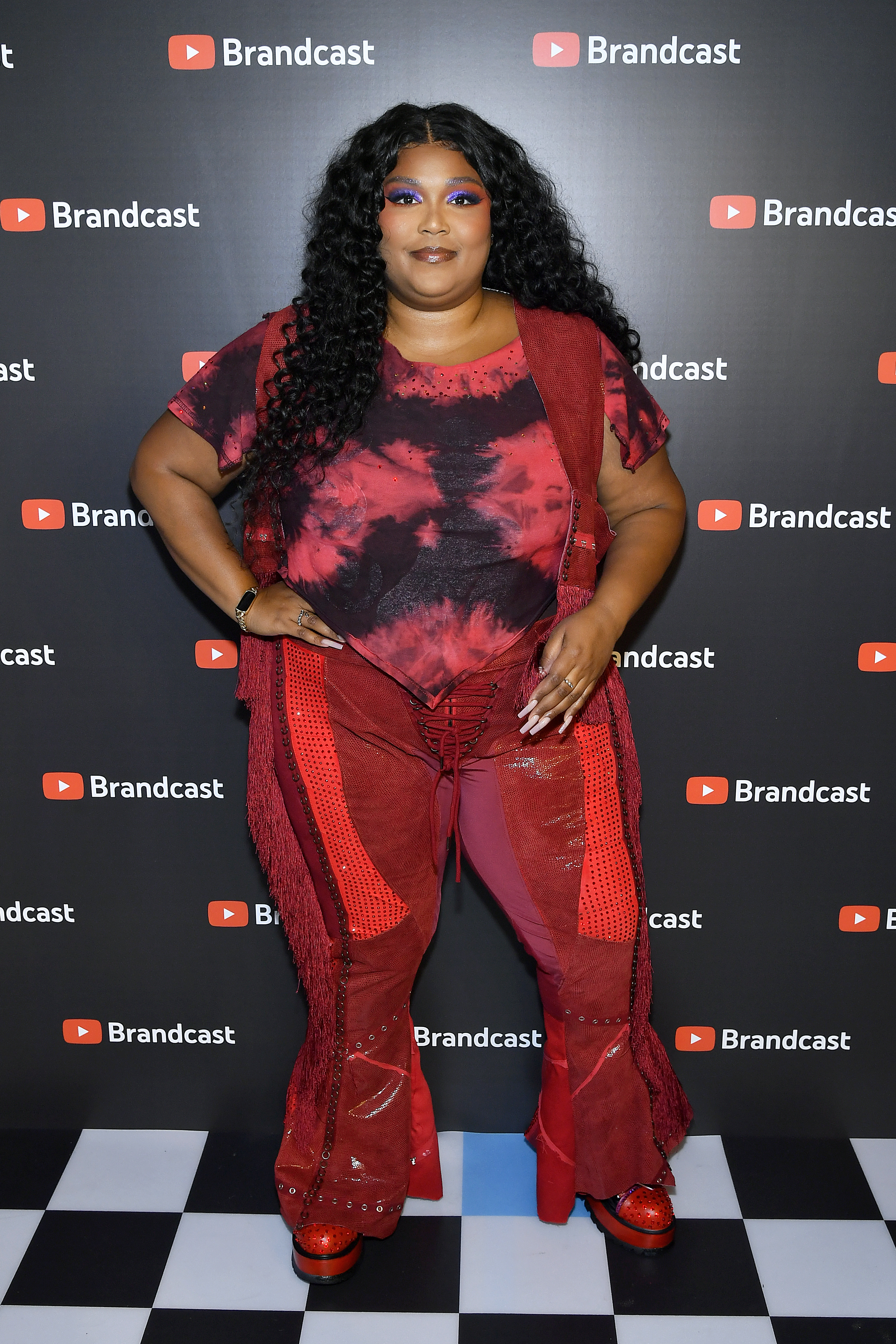 lizzo posing at an event