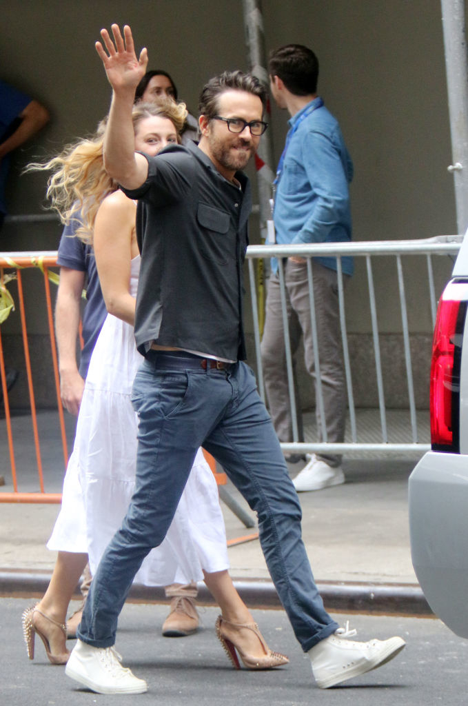 ryan waving at fans while walking with blake