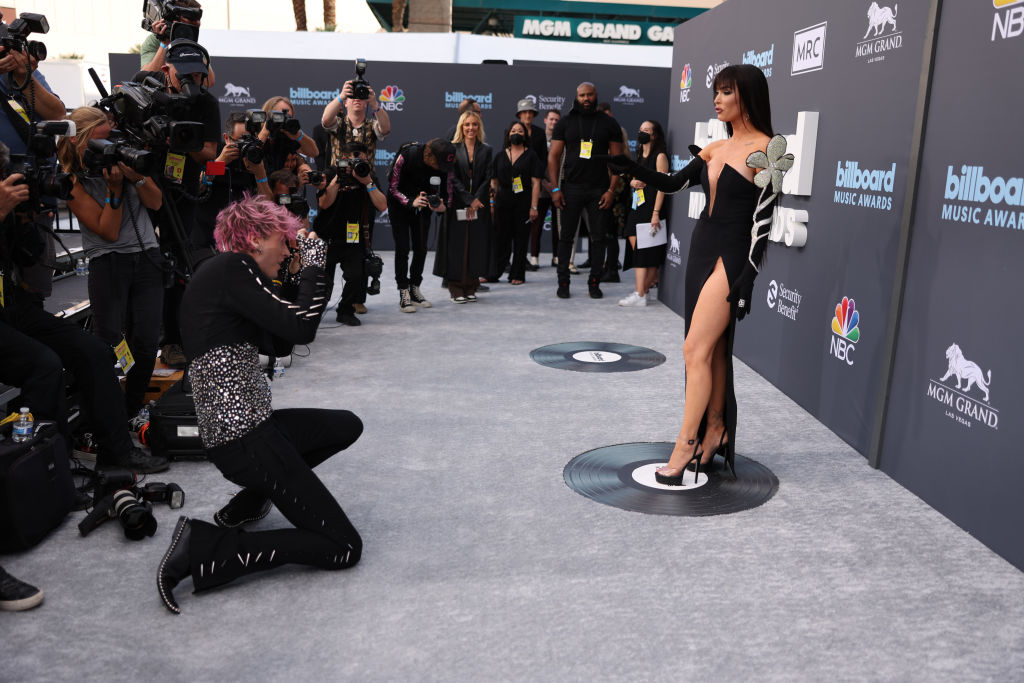 MGK taking photos of megan at an event