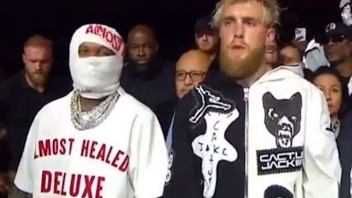 The news arrived on the rapper's t-shirt worn as he walked Paul out to victory against Nate Diaz.