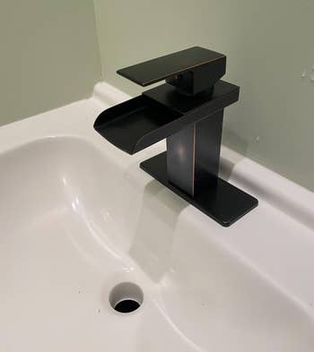 reviewer image of the bronze faucet