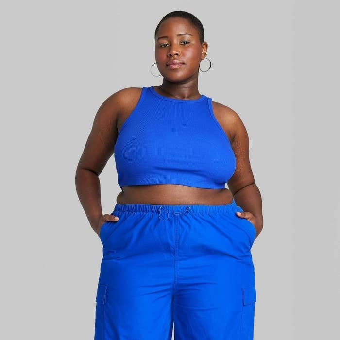 A model wearing a blue top with matching blue bototms