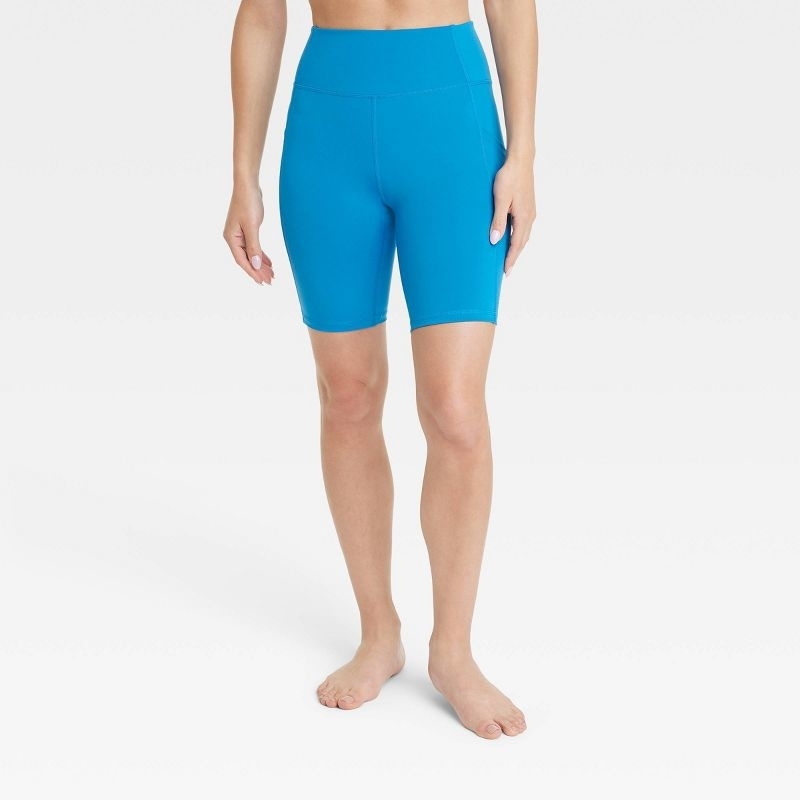 A model wearing blue bike shorts