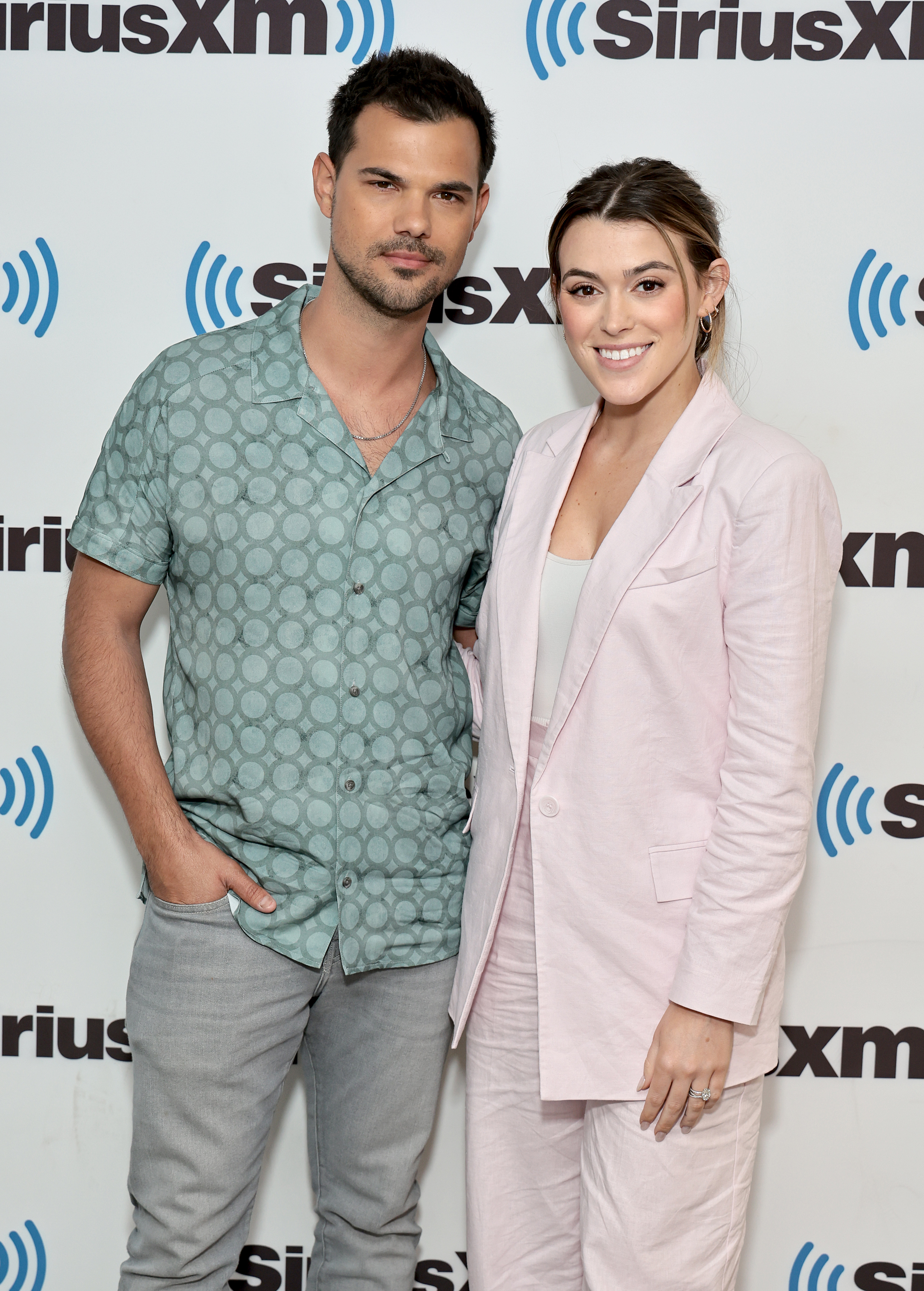 Lautner and Tay at a media event