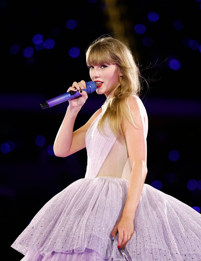 Close-up of Taylor Swift performing in a ball gown