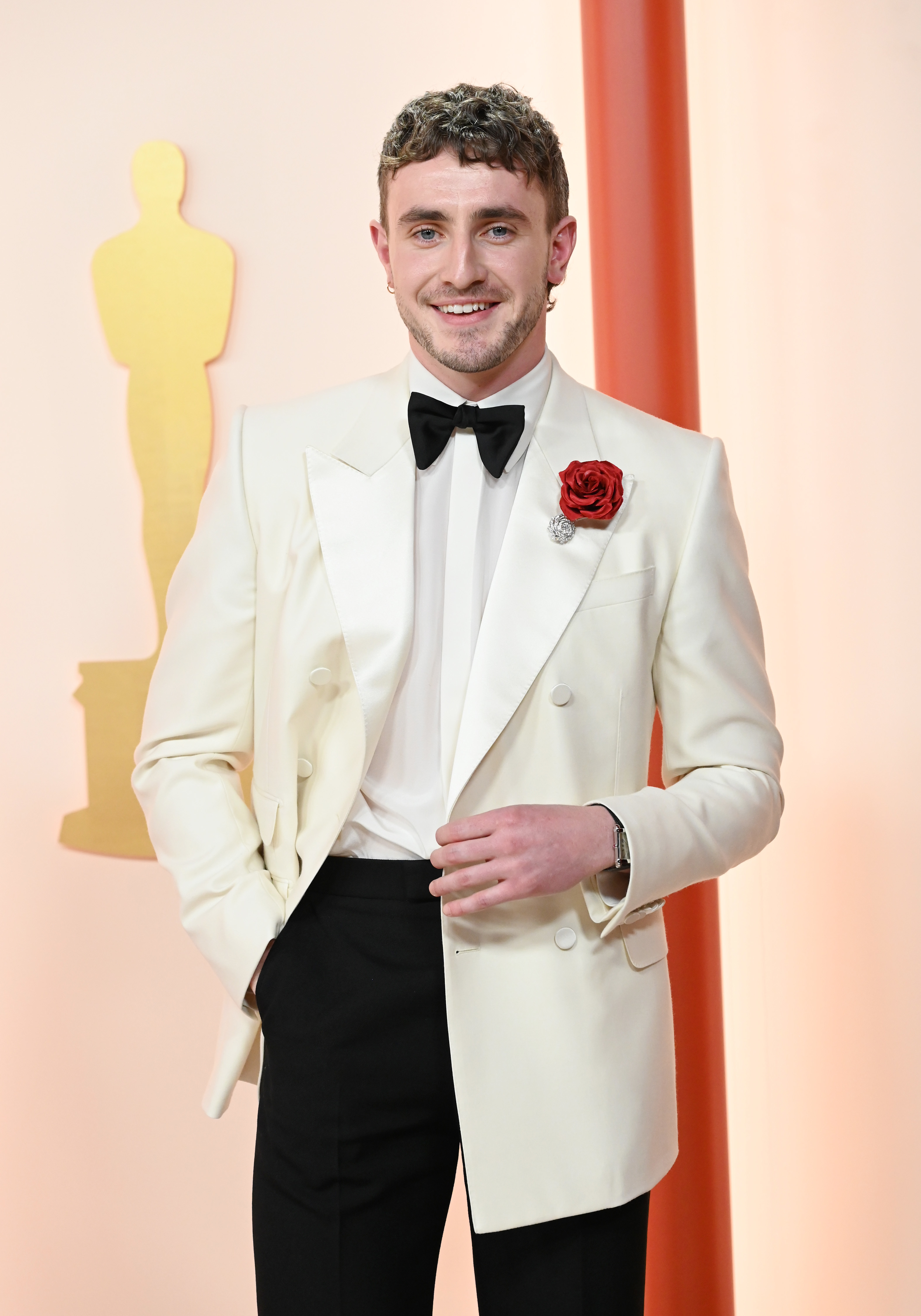 A closeup of Paul Mescal in a tuxedo on the red carpet