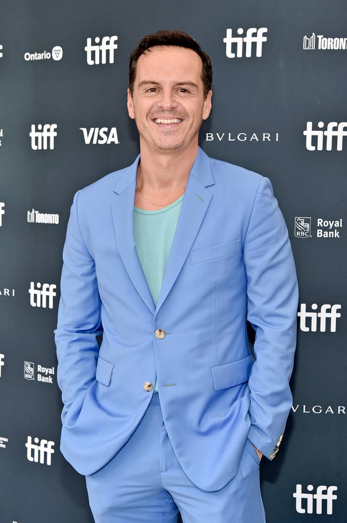 A closeup of Andrew Scott smiling on the red carpet
