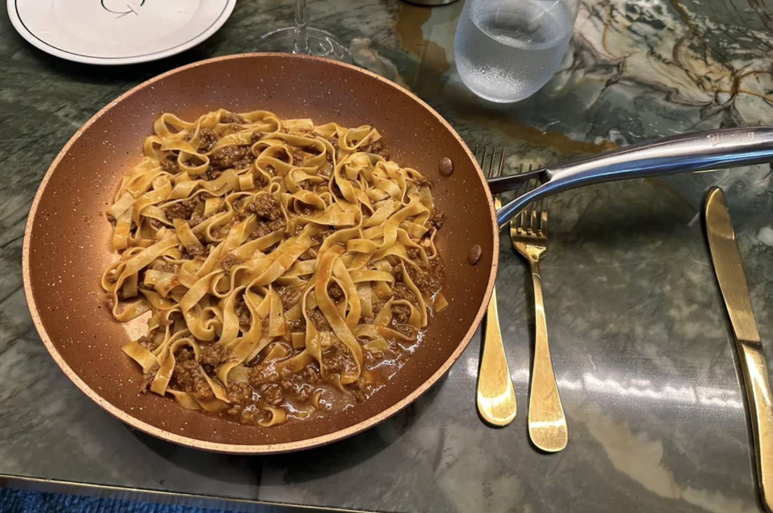 Noodles in a skillet on a table