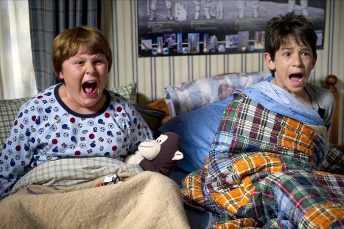 Two kids screaming in bed in Diary of a Wimpy Kid