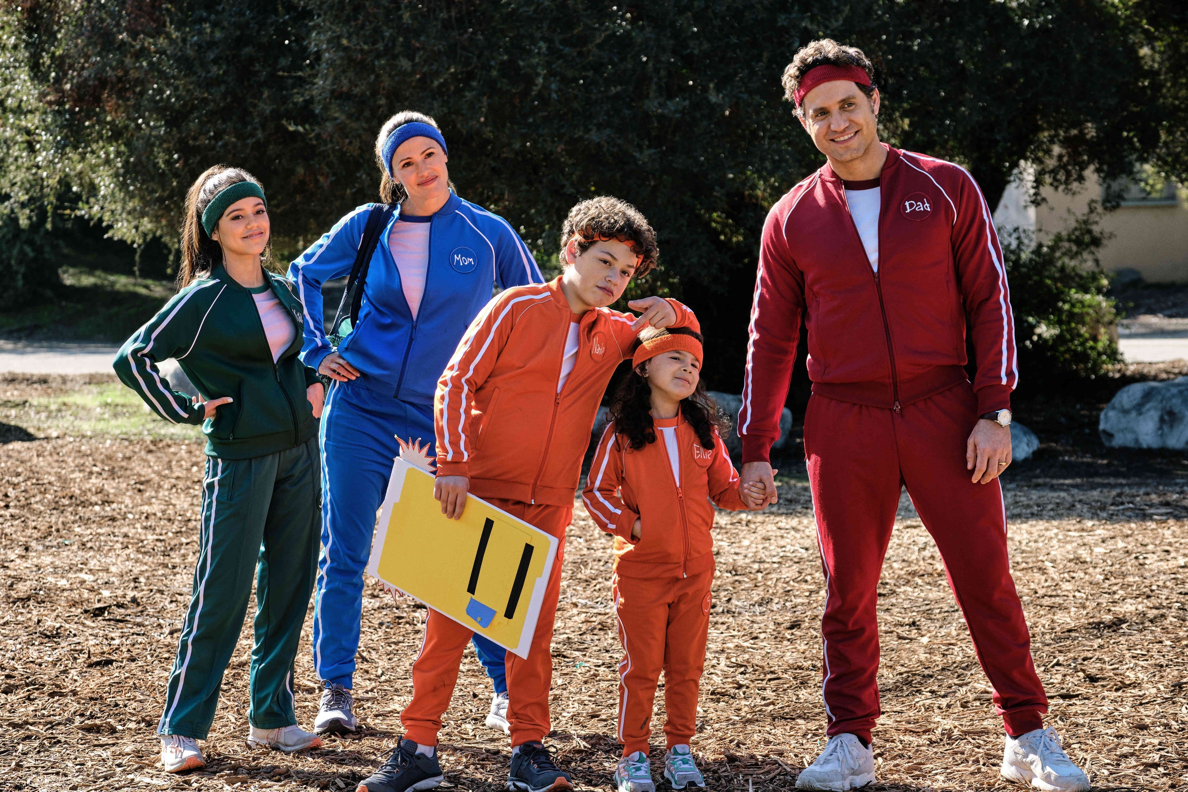 A family wearing different colored tracksuits in Yes Day