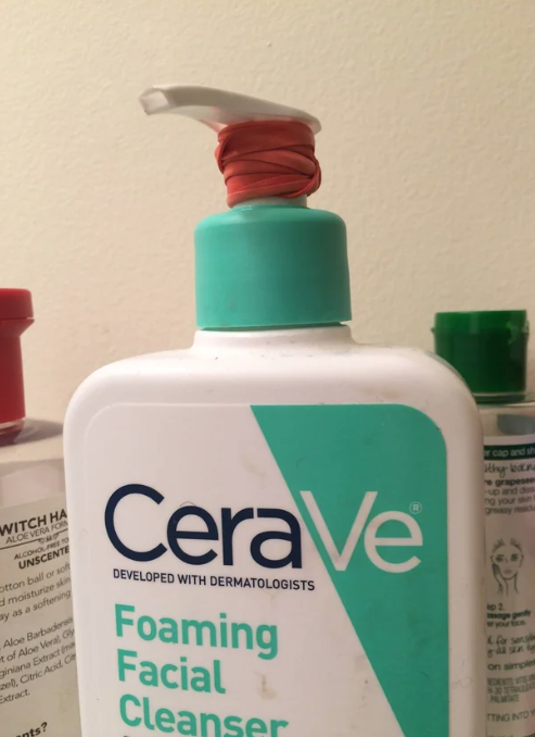 A rubber band on a pump bottle of CeraVe