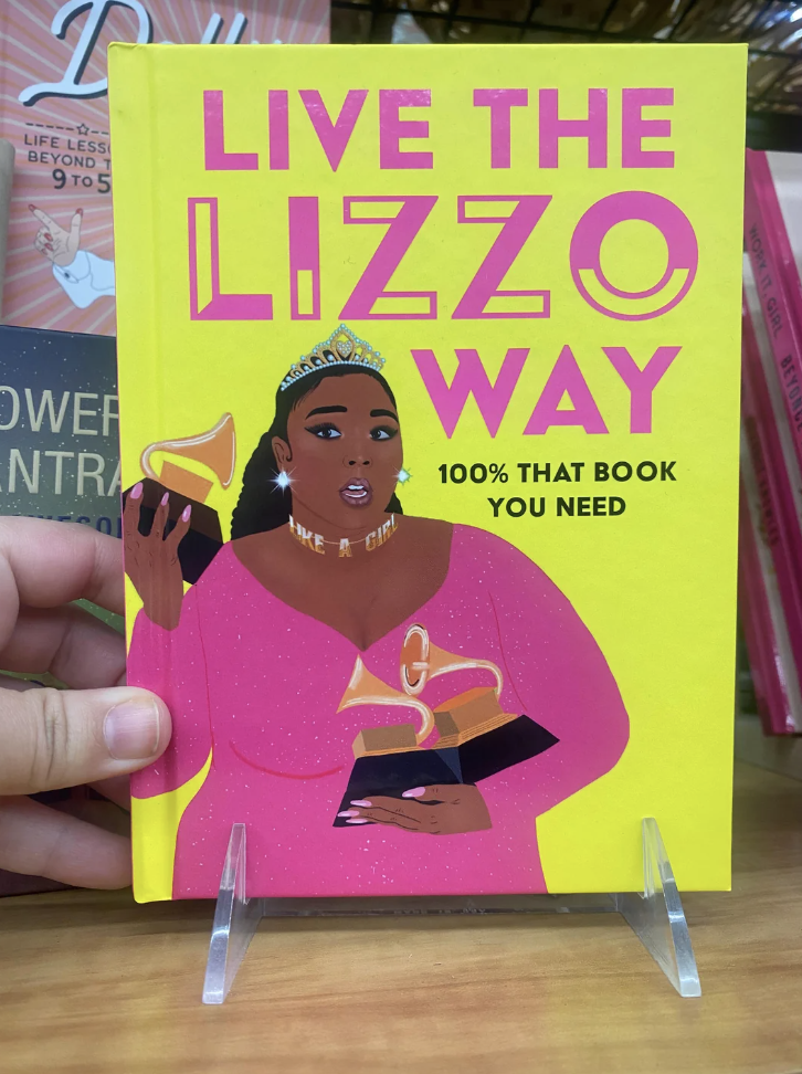 The cover of the book shows Lizzo holding multiple Grammy Awards and says &quot;100% that book you need&quot;