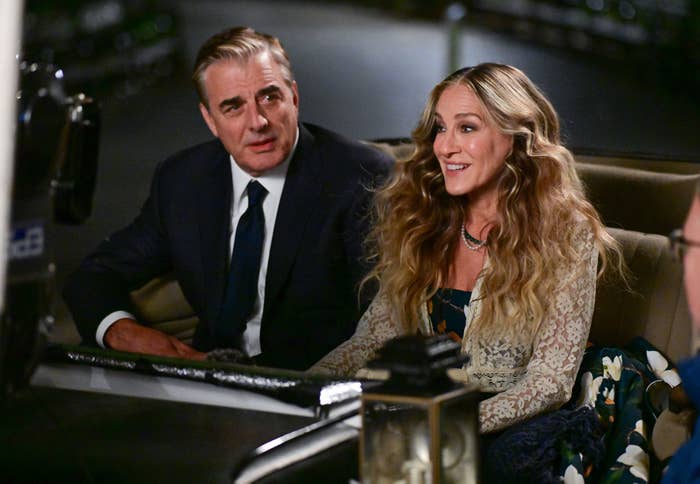 Mr. Big. and Carrie Bradshaw sitting next to each other