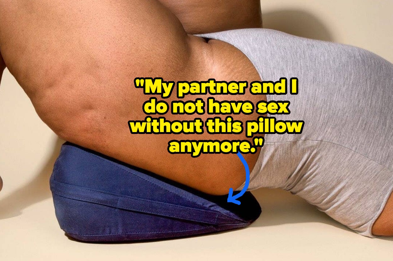 Model posing on blue wedge pillow