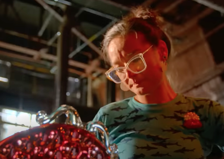 A woman working on glass