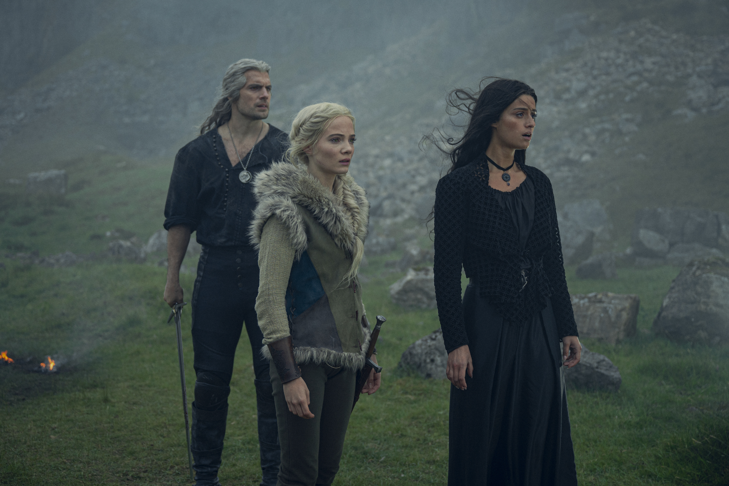 Ciri, Geralt, and Yennefer in an outdoor scene