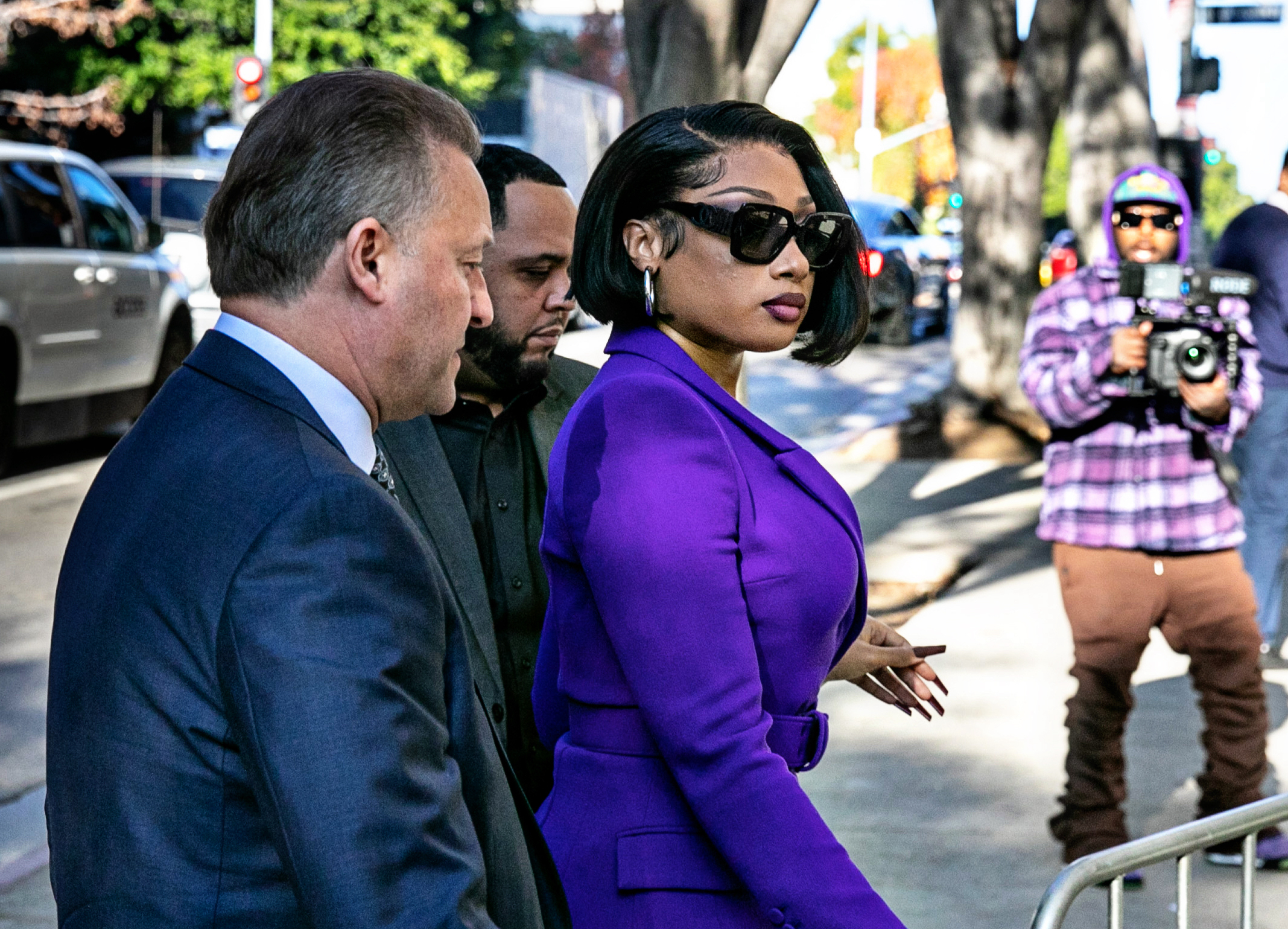 Megan Thee Stallion walking into a courtroom