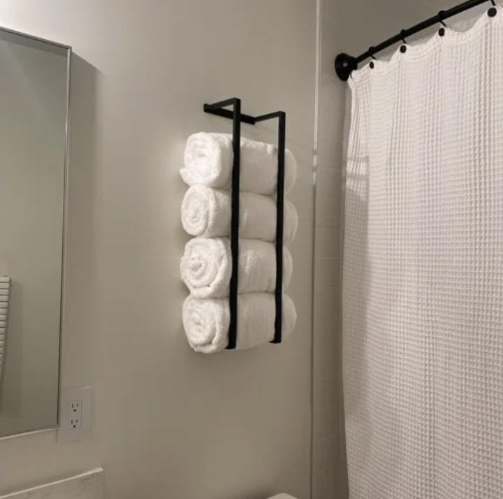 A reviewer&#x27;s mounted towel rack
