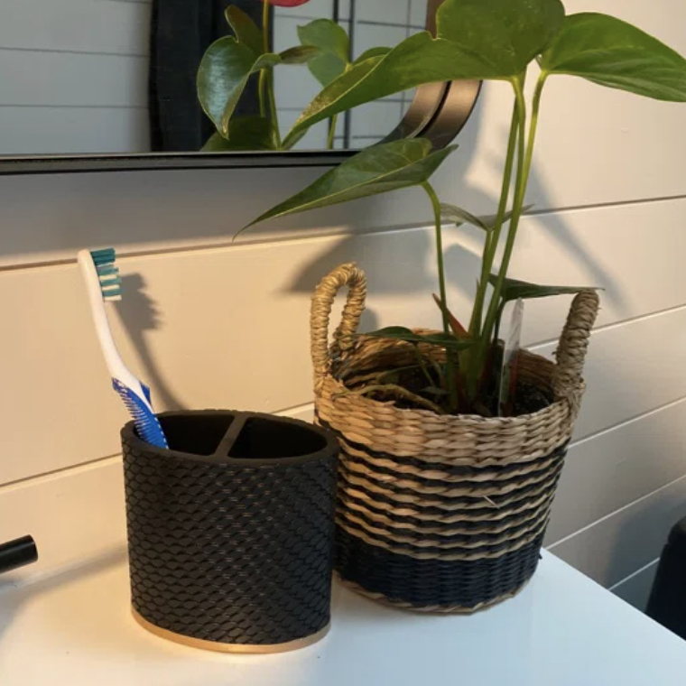A reviewer&#x27;s toothbrush holder