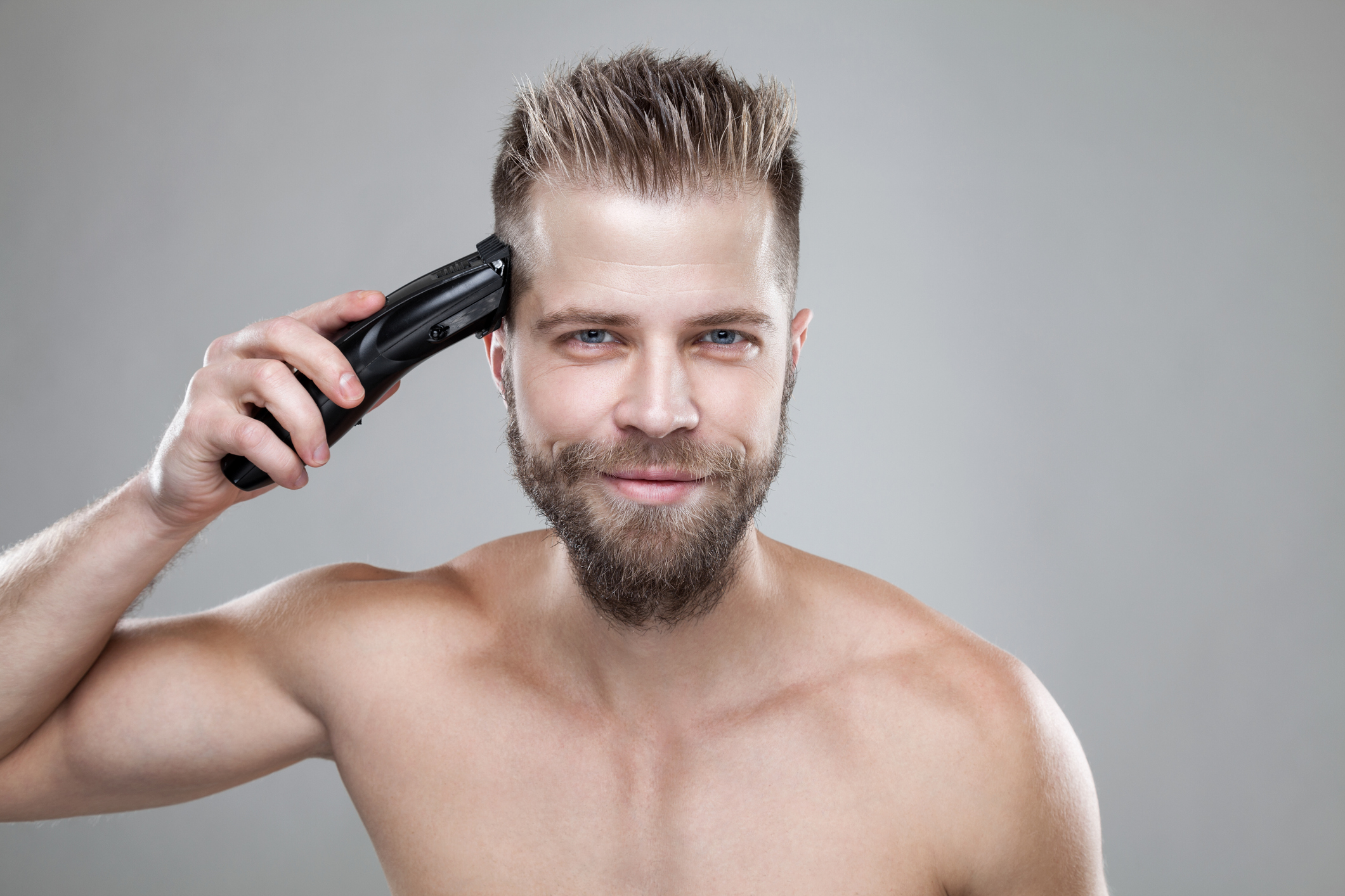 person shaving their head