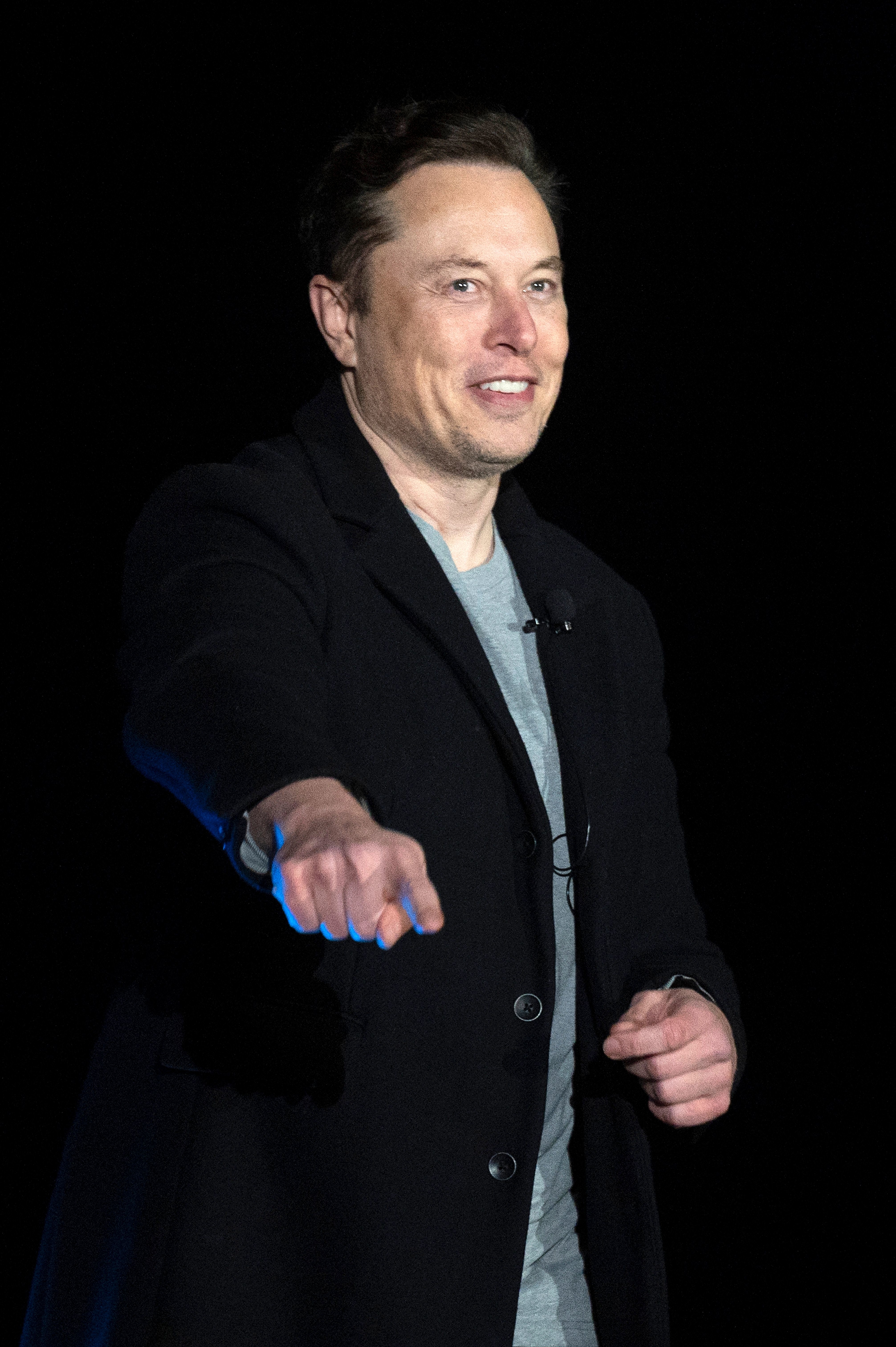 Close-up of Elon smiling and pointing