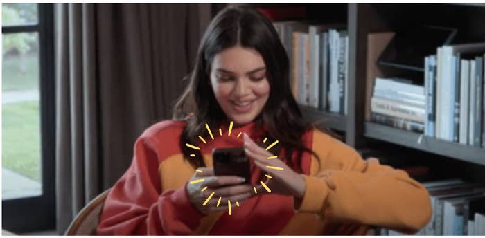 Kendall Jenner texts on her phone.