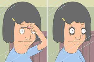 tina putting on mascara and it getting smudged all around her eyes 