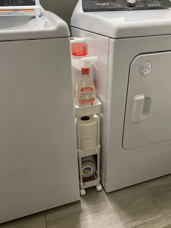 Reviewer image of the cart in between their washer and dryer