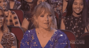 Taylor Swift at the iHeartRadio awards cringing