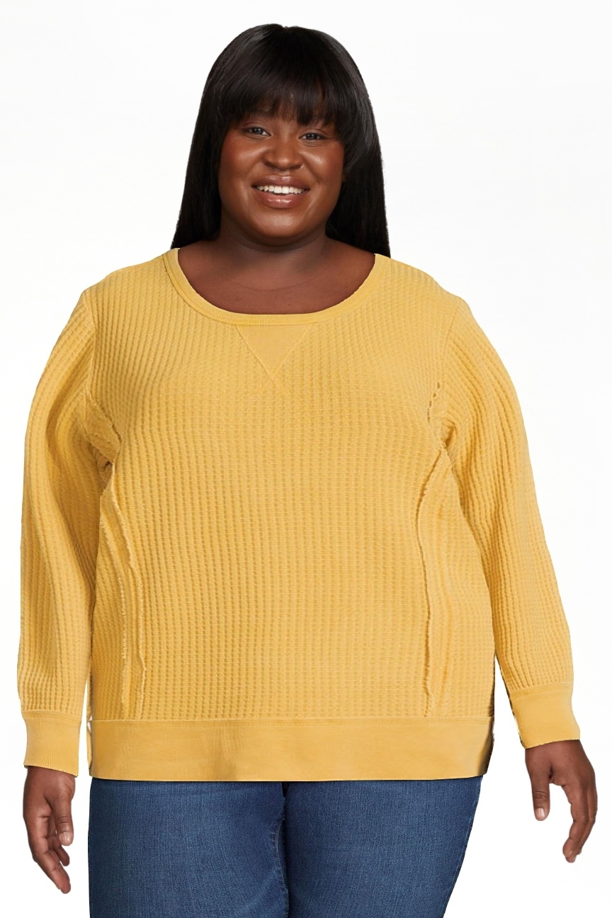 Model wearing the gold tea pullover