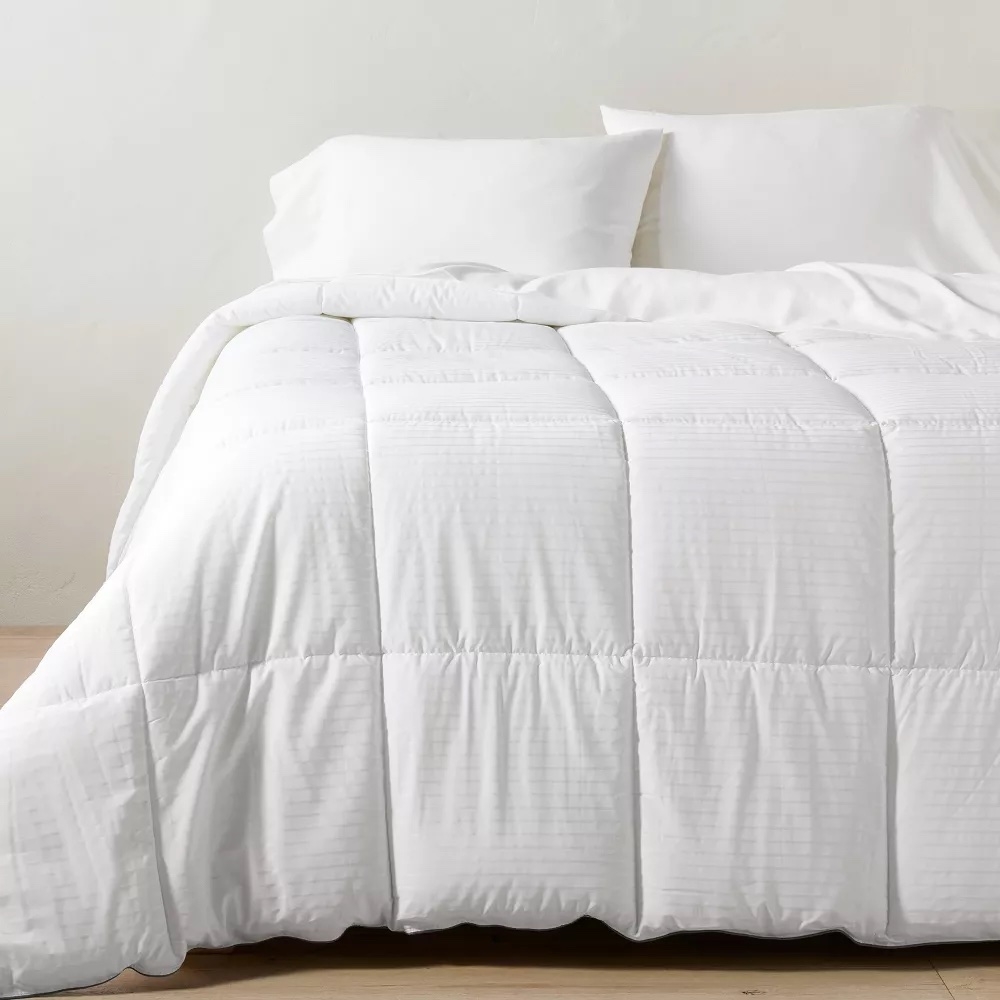 White duvet insert on a bed