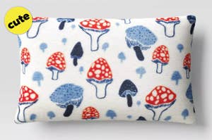 a lumbar pillow with mushroom illustrations