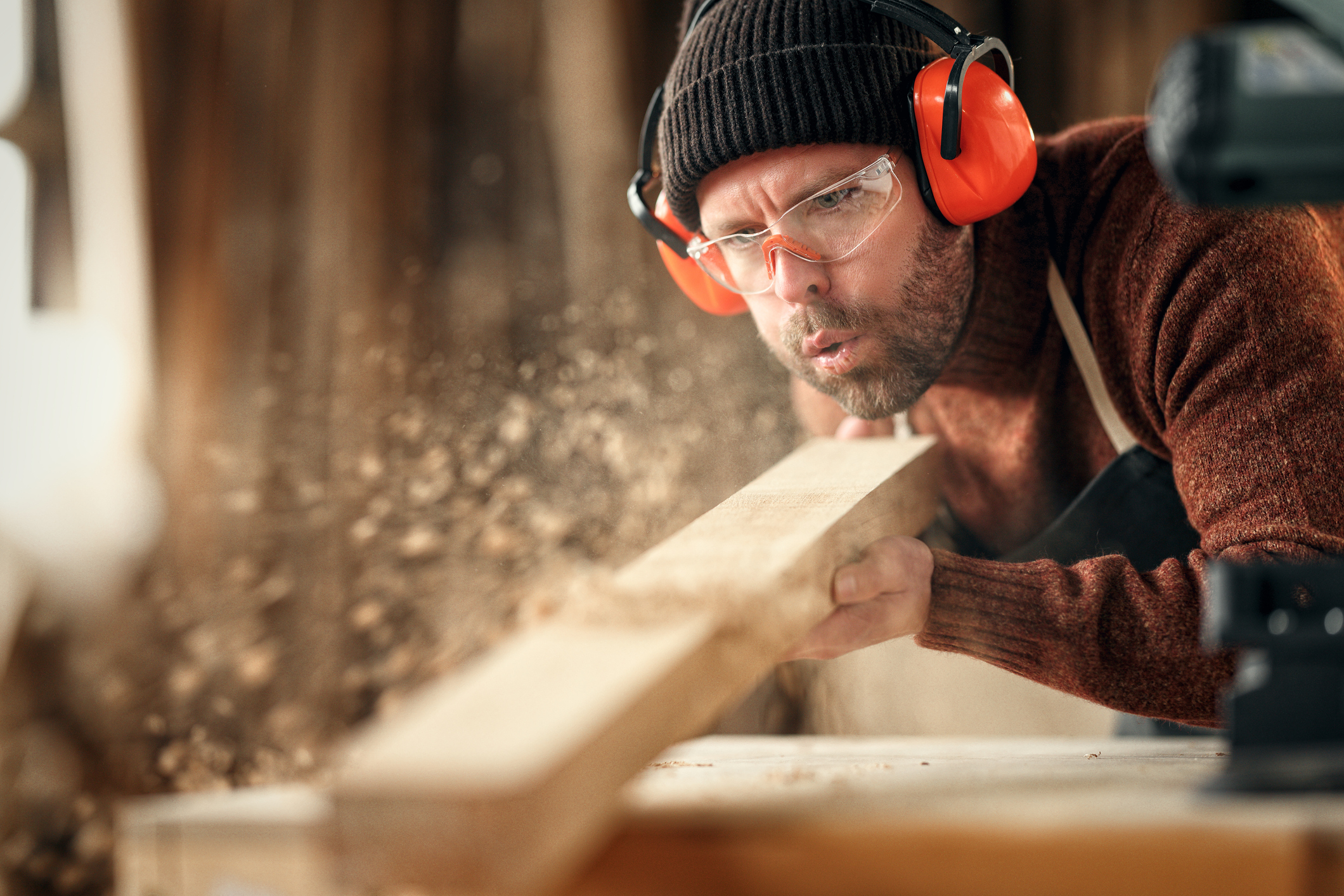 A man sanding wood
