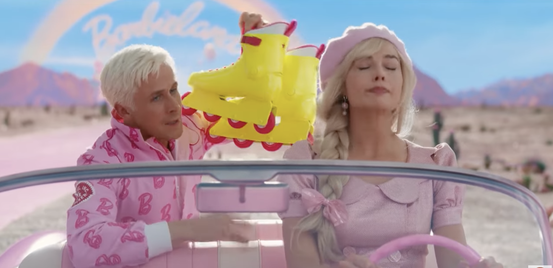 Barbie and Ken from the &quot;Barbie&quot; movie are in the car. Ken is holding up roller skates