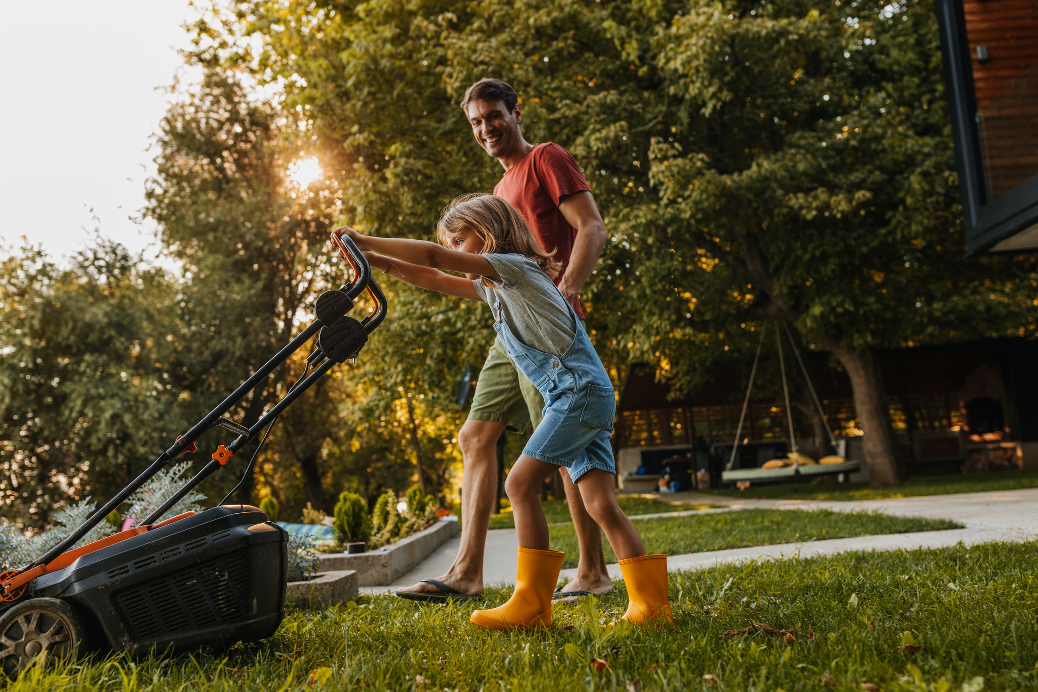 kid mowing the lawn