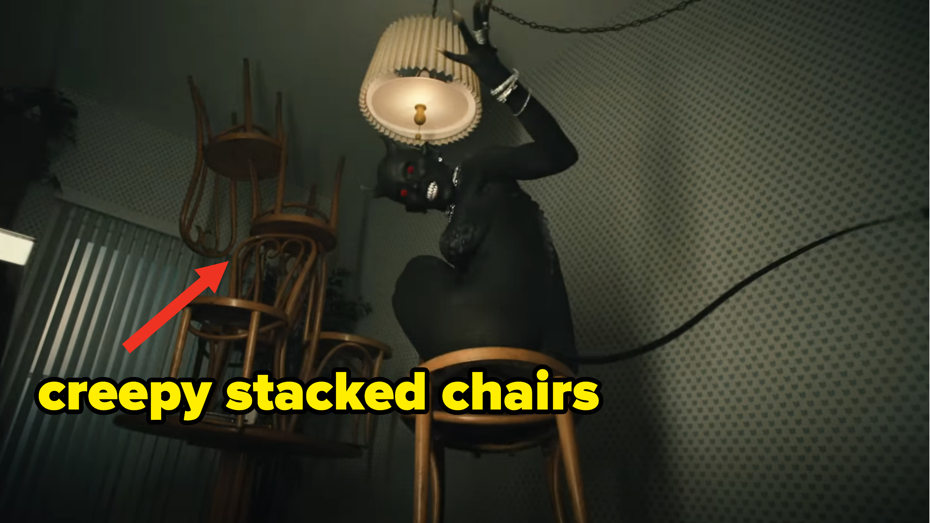 Creepy stacked chairs on the ceiling in the video