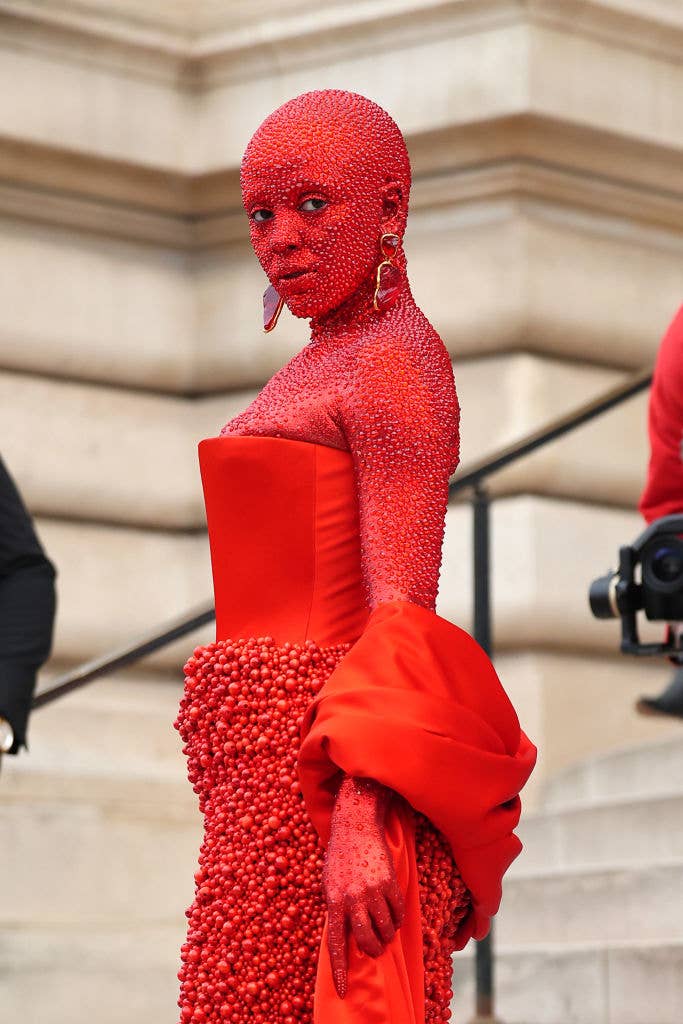 Close-up of Doja in a red Swarovski crystal suit